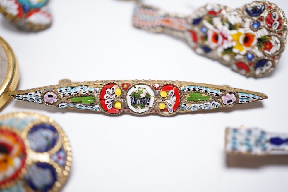 A collection of twenty-eight micro-mosaic brooches, including ten banjo and guitars shaped brooches, six similar large oval brooches, nine small brooches and three long brooches. (28) Condition - good